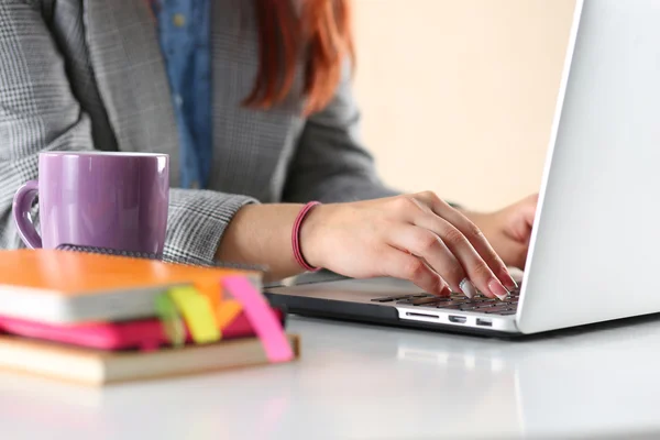 Close up view of businesswoman hands working on laptop Stock Picture