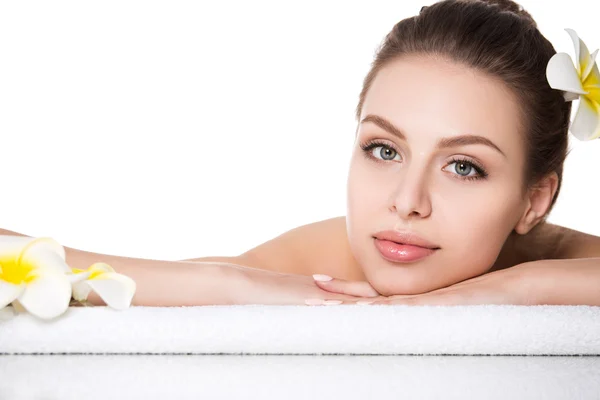 Portrait of young beautiful woman laying in spa salon — Stock Photo, Image