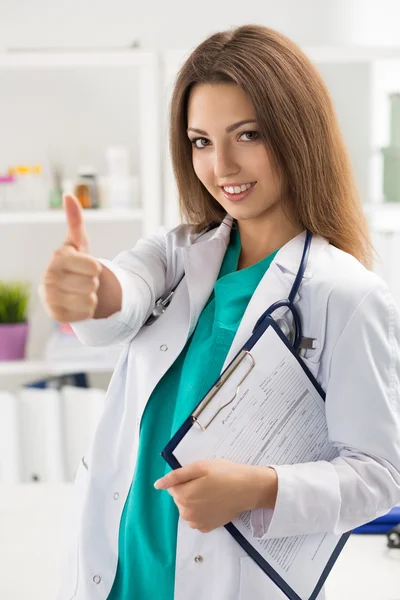 Smiling female medicine doctor showing thumb up — Stock Photo, Image