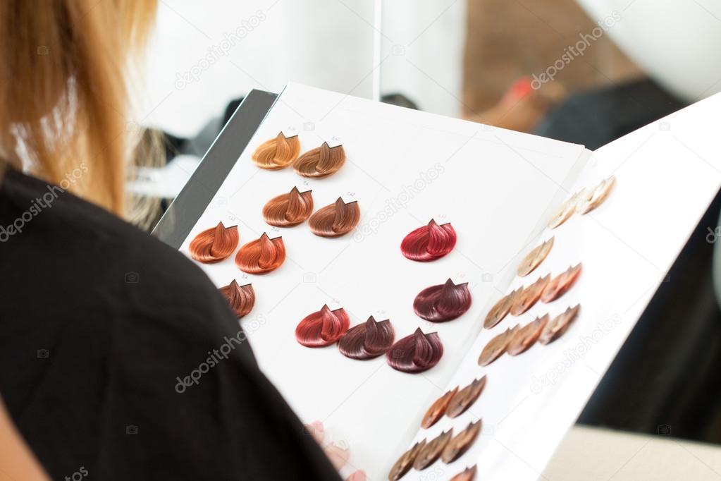 Woman looking at the book of color samples