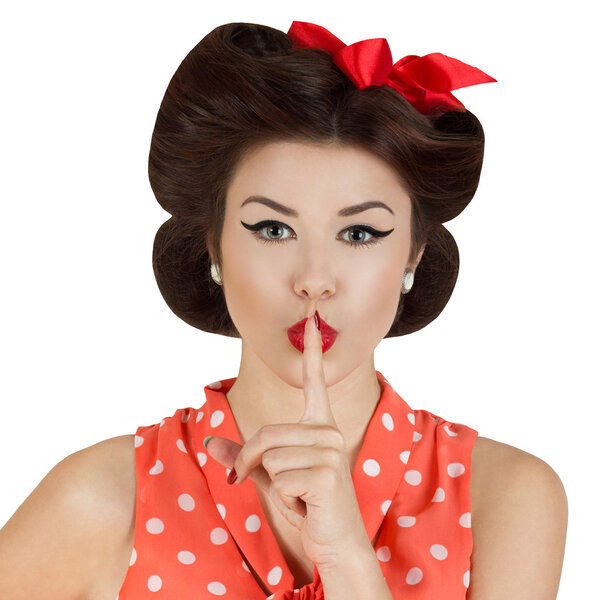 Pin-up style girl with finger on lips