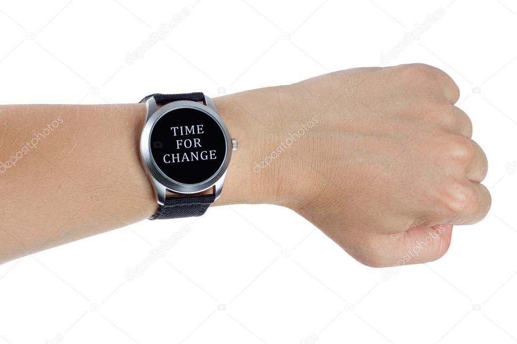 A hand wearing a black wrist watch. Time for change concept