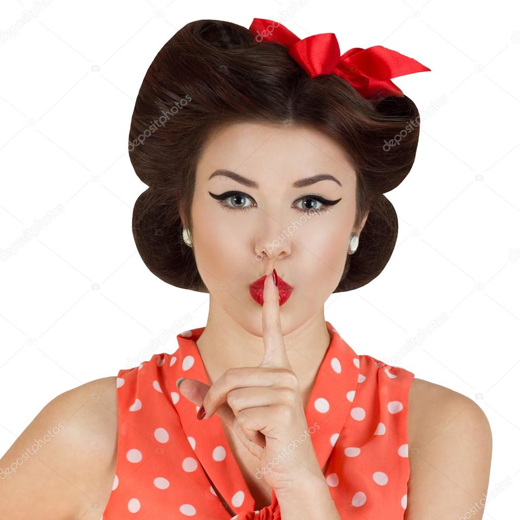 Pin-up style girl with finger on lips