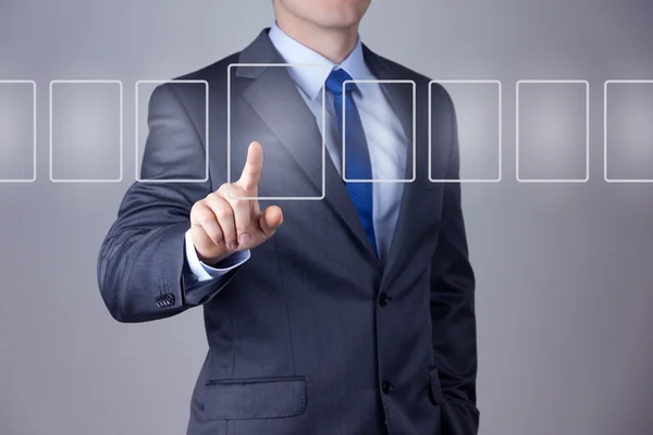 Businessman pushing on a touch screen interface — Stock Photo, Image