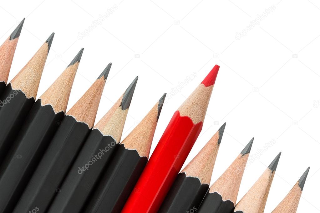Red pencil standing out from the row of black pencils