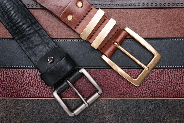 Close-up of two men belts — Stock Photo, Image