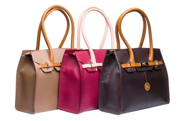 Beyaz izole üç doğal deri kadın çantaları