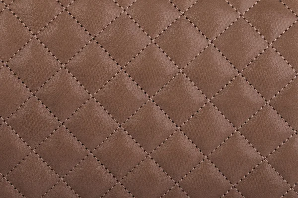 Light borwn quilted leather close-up