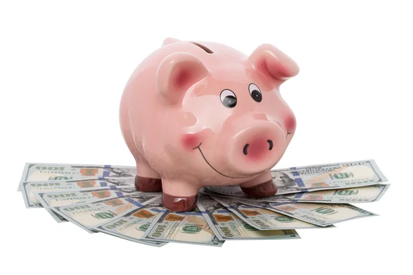 Grappige piggy bank staande over hoop geld — Stockfoto