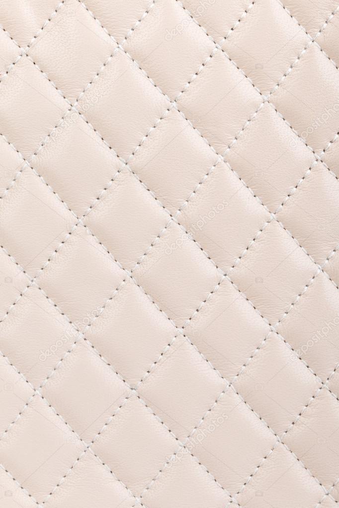 Milky white quilted leather background