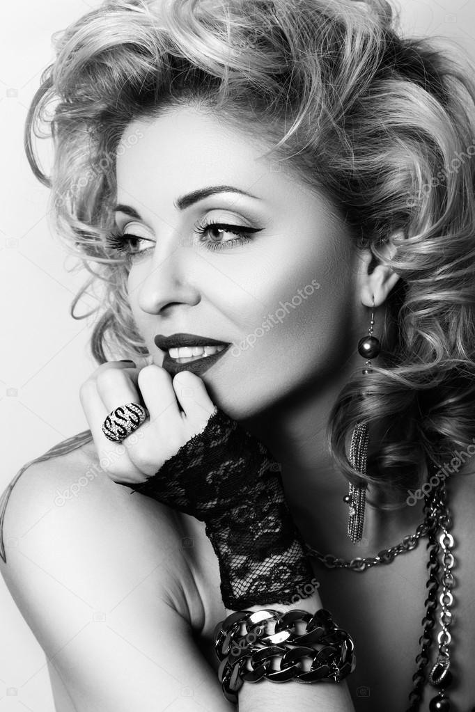 Retro styled black and white portrait of sexy adult woman with l