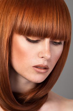 Closeup portrait of red haired woman clipart