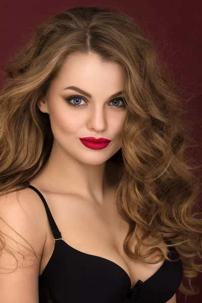 Portrait of coquette young curly woman with red lips — Stock Photo, Image