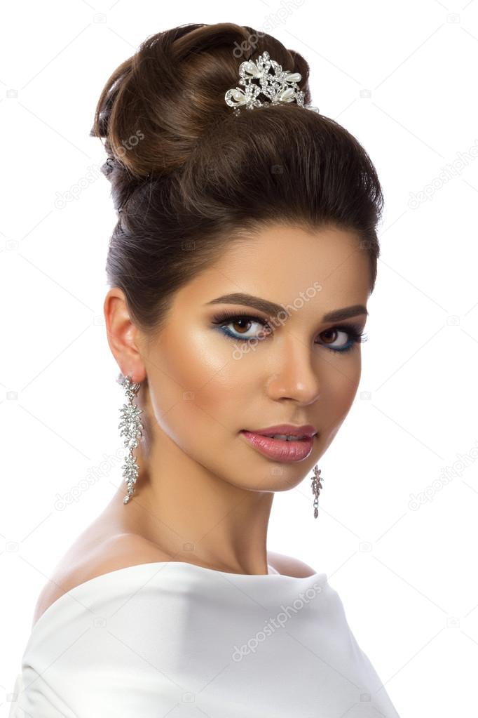 Portrait of young beautiful woman wearing white dress 