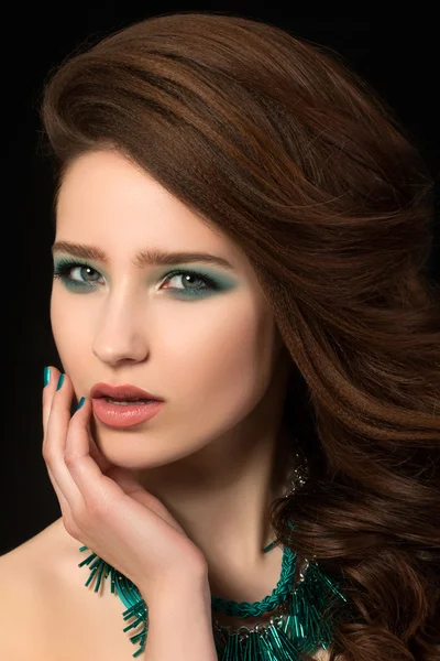 Portrait of beautiful young woman with blue nails and eye makeup — Stock Photo, Image