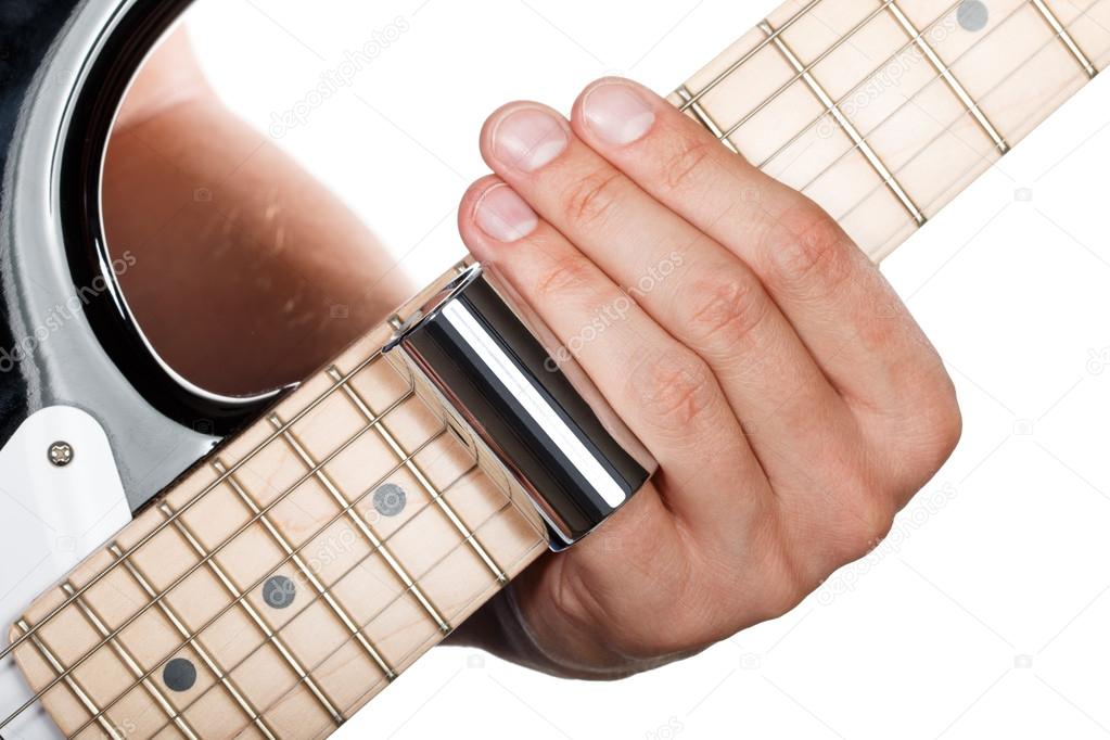 Hands of man playing electric guitar