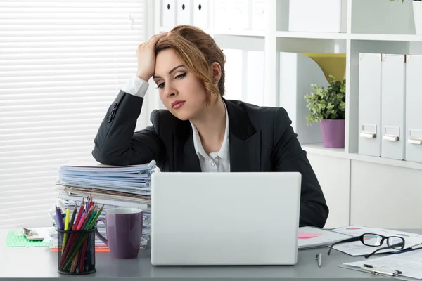 Portrait of tired business woman at work Royalty Free Stock Images