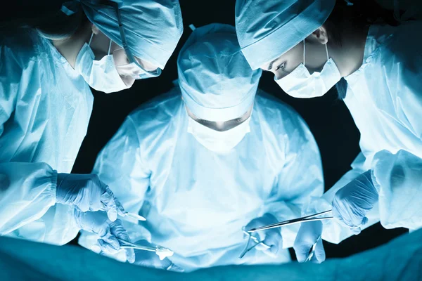 Medical team performing operation Stock Picture