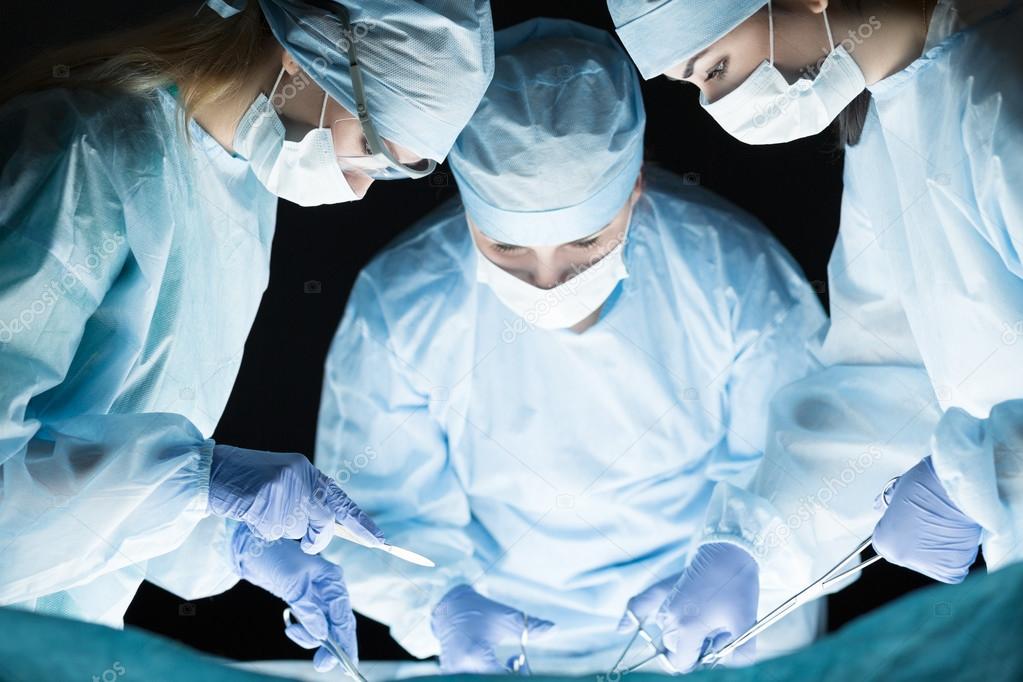 Medical team performing operation