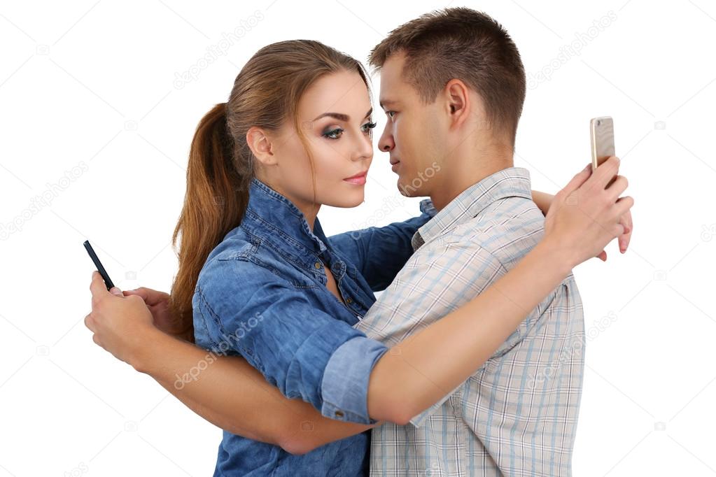 Portrait of young couple standing together and ignoring each oth