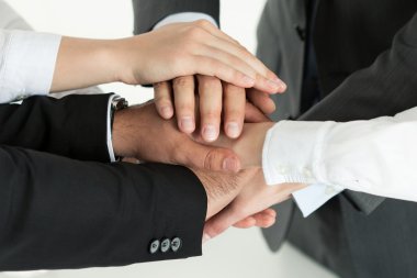 Closeup of business team showing unity