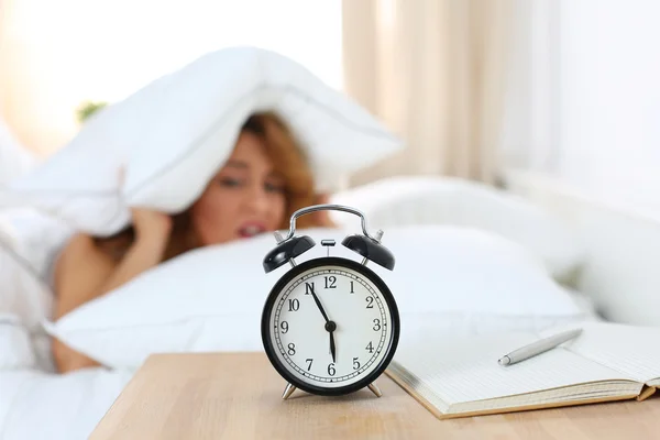 Young beautiful woman hates waking up early in the morning — Stock Photo, Image