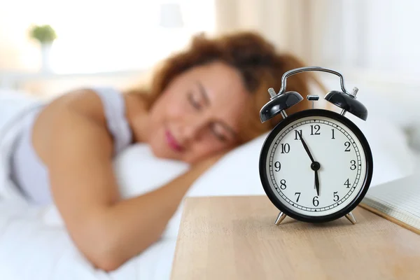 Beautiful happy woman sleeping in her bedroom in the morning Royalty Free Stock Photos