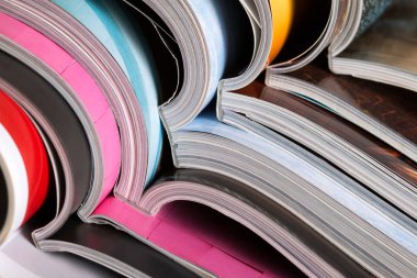Stack of colorful magazines clipart