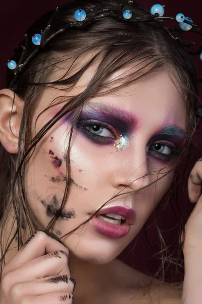 Close-up portrait of a young girl with fashion creative make-up — Stock Photo, Image