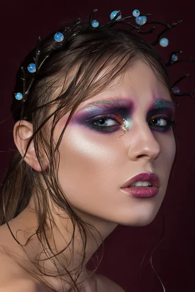 Beauty portrait of a young girl with fashion creative make-up — Stock Photo, Image