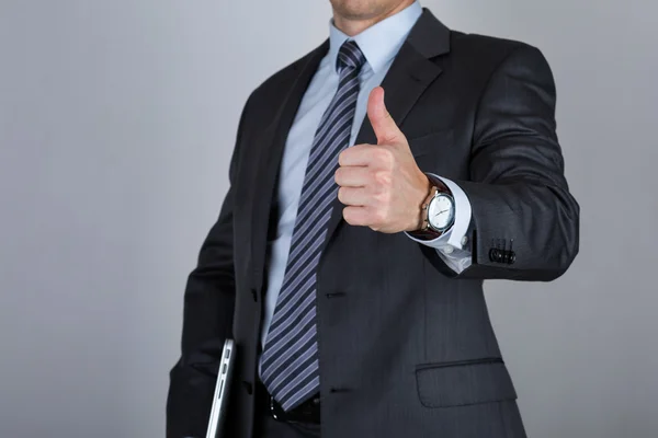 Biznes człowiek pokazując kciuki w górę — Zdjęcie stockowe