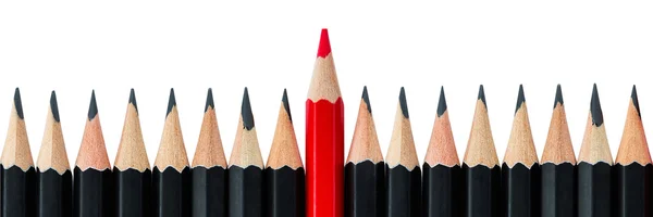 Row of black pencils with one red pencil in middle — Stock Photo, Image