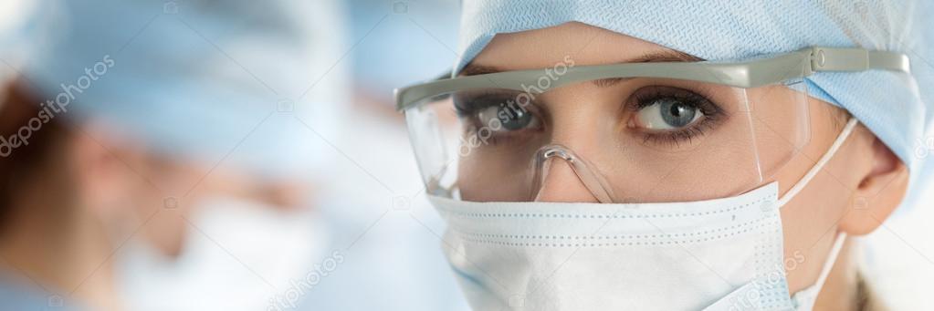 Close-up of surgeon woman looking at camera