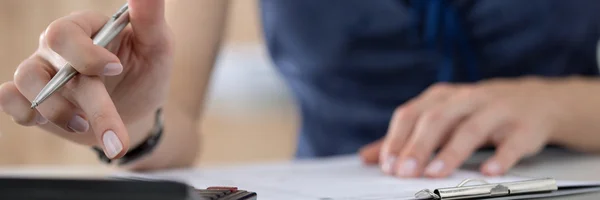 Close up of female accountant or banker making calculations — Stock Photo, Image