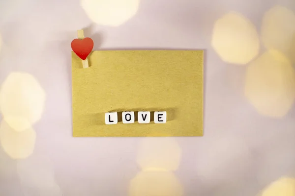 The word love consists of cubes with a space for the signature. — Stock Photo, Image