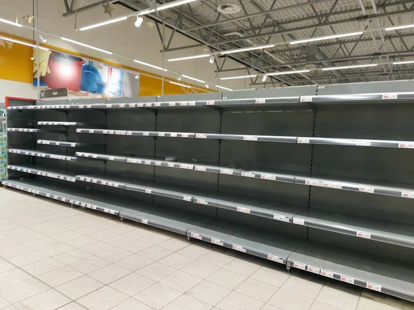 Empty shelves in stores. Empty shelves in stores.Supermarket shelves in perspective.