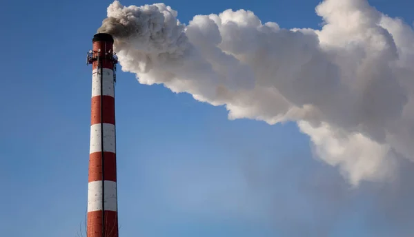 Smoke from the factory chimney. The concept of environmental protection