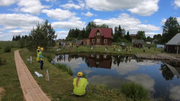 Children on a fishing trip. Fishermans Day on a fishing farm . July 14, 2020 in Ustye, Russia. — Stock Video