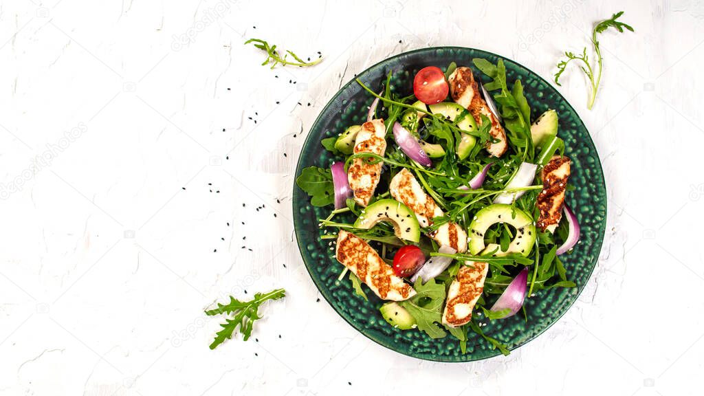 grilled Halloumi cheese with salad fresh tomatoes and avocado. Healthy food, diet lunch concept. diet menu. Keto Paleo diet menu. Top view, overhead, banner,