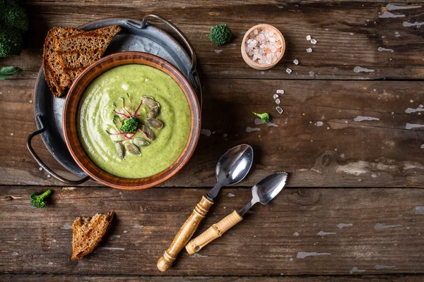 Broccoli cream soup, vegan, vegetarian eating, Vegan soup puree of green vegetables. Vegetarian and diet food. banner, catering menu recipe place for text, top view.