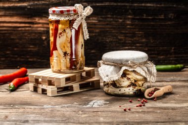 Assortment of cheese. Soft, hard, cheese balls. Ecology and eco-products, Jar with cheese marinated in oil,