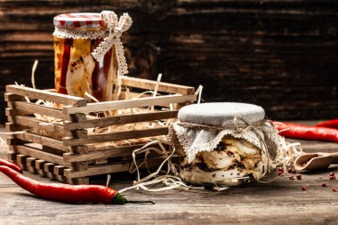 iraqi traditional cheese made from buffalo milk. Cheese in marinade with olive oil, chili and basil, hand made.