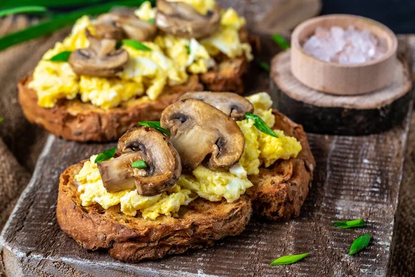 wholewheat toast with scrambled eggs with mushrooms and cottage cheese. healthy breakfast or brunch. banner, menu recipe place for text, top view.