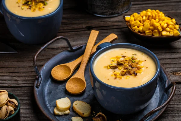 Creamy corn soup with roasted pistachios and croutons, Healthy food. Vegan cuisine. Restaurant menu, dieting, cookbook recipe.