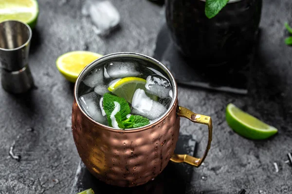 Icy cold moscow mules with ginger beer and vodka. splashes frozen motion. banner, menu, recipe, place for text.