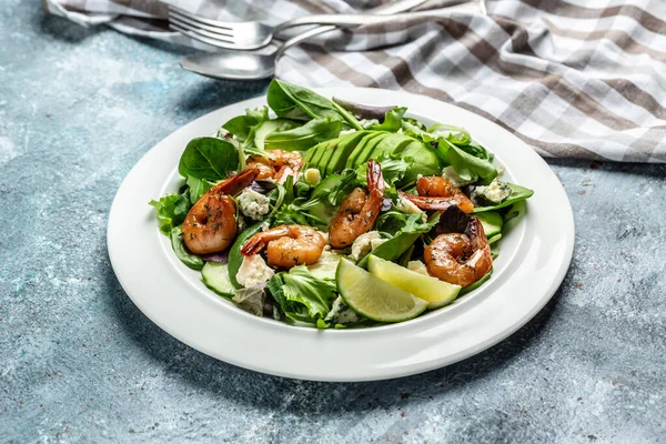 Vegan vegetarian dinner background. Seafood salad with avocado, blue cheese and smoked shrimps. Healthy eating concept. Detox diet. Vegetarian lunch. Weight loss.