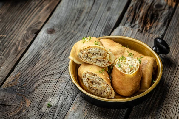 Russian pancakes with meat. traditional maslenitsa meal. Homemade filled by chicken meat crepe rolls. banner, menu recipe place for text, top view.