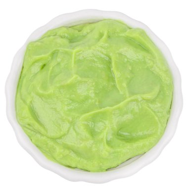 Bowl of creamy avocado puree isolated on white background, fresh green guacamole sauce, healthy organic food concept with copy space for advertising or banner