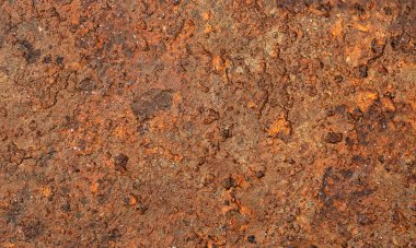 Paslı paslı metal yüzeye yakın plan zengin kahverengi ve turuncu tonlar, kaba doku ve doğal çürüme, kopyalama alanı olan ideal endüstriyel arkaplan