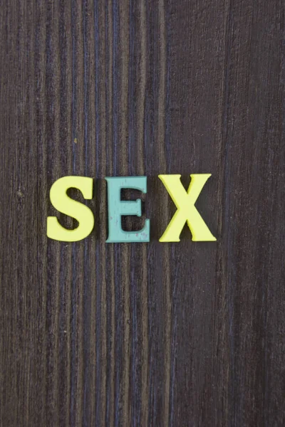 Parole Sex Scritte Una Lettera Multicolore Uno Sfondo Scuro — Foto Stock